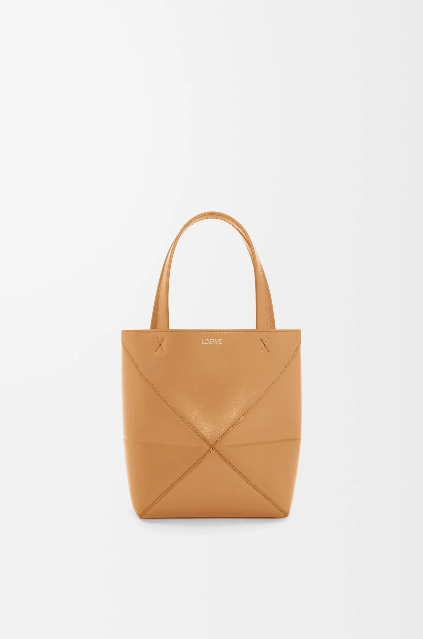98a7da617a83a8a262b2b020f2533621-scaled-1.webp Mini Puzzle Fold tote in shiny calfskin - Image 1